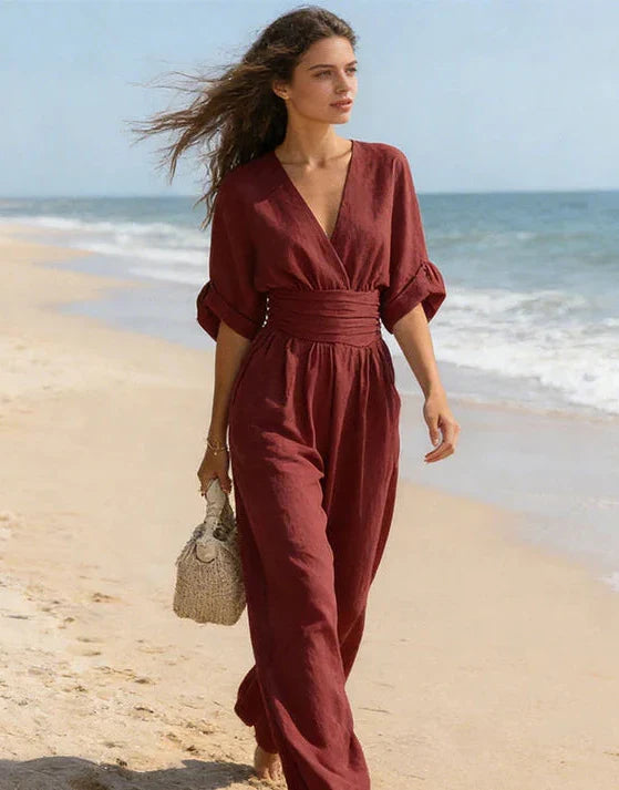 Chic women's one-piece jumpsuit with a wide leg and wrap front, an elegant evening fashion statement.
