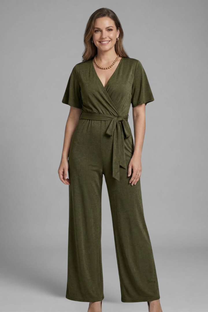 Women's elegant short sleeve V-neck jumpsuit with a flattering wrap front and tie waist. Versatile wear.