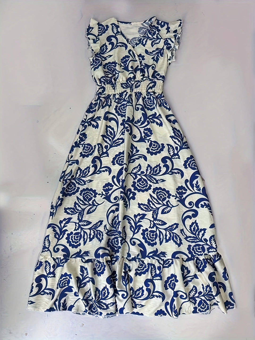 Full-length women's elegant ruffle cap sleeve wrap maxi dress, V-neck, smocked waist, and tiered hem.