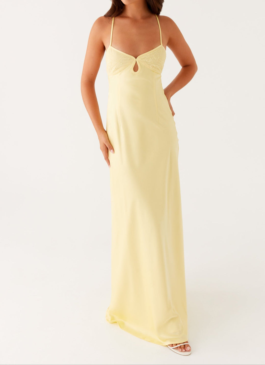Sophisticated women's yellow halterneck maxi dress. Elegant formal wear, a beautiful choice for special events.