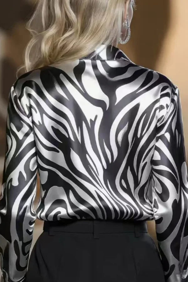 Professional women's collared zebra print button down shirt with long sleeves, a stylish choice for workwear fashion.