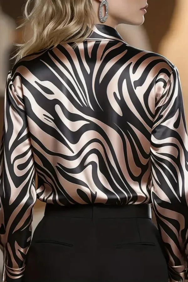 Fashionable women's long sleeve zebra print button down shirt, an elegant and dressy top for work and evening wear.