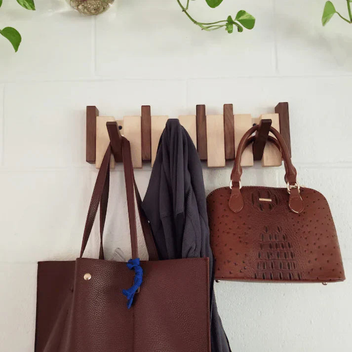 Home entryway wooden coat rack, piano key design. Space-saving wall storage with wood finish.