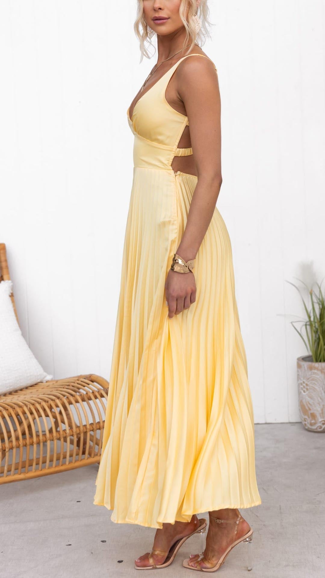 Stylish yellow V-neck pleated midi dress, an elegant choice for women attending weddings, parties, or special occasions.