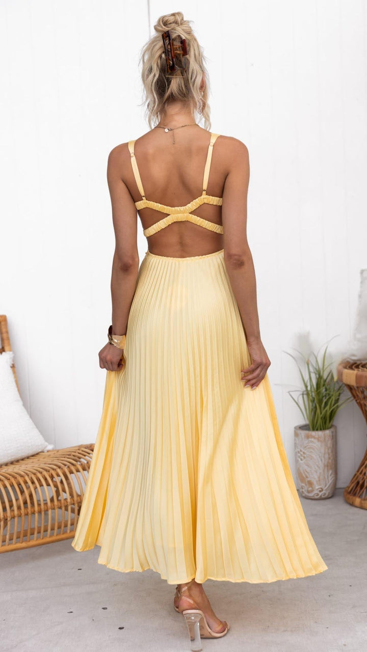 Fashionable women's yellow V-neck pleated midi dress, an elegant summer wedding guest or party dress option.