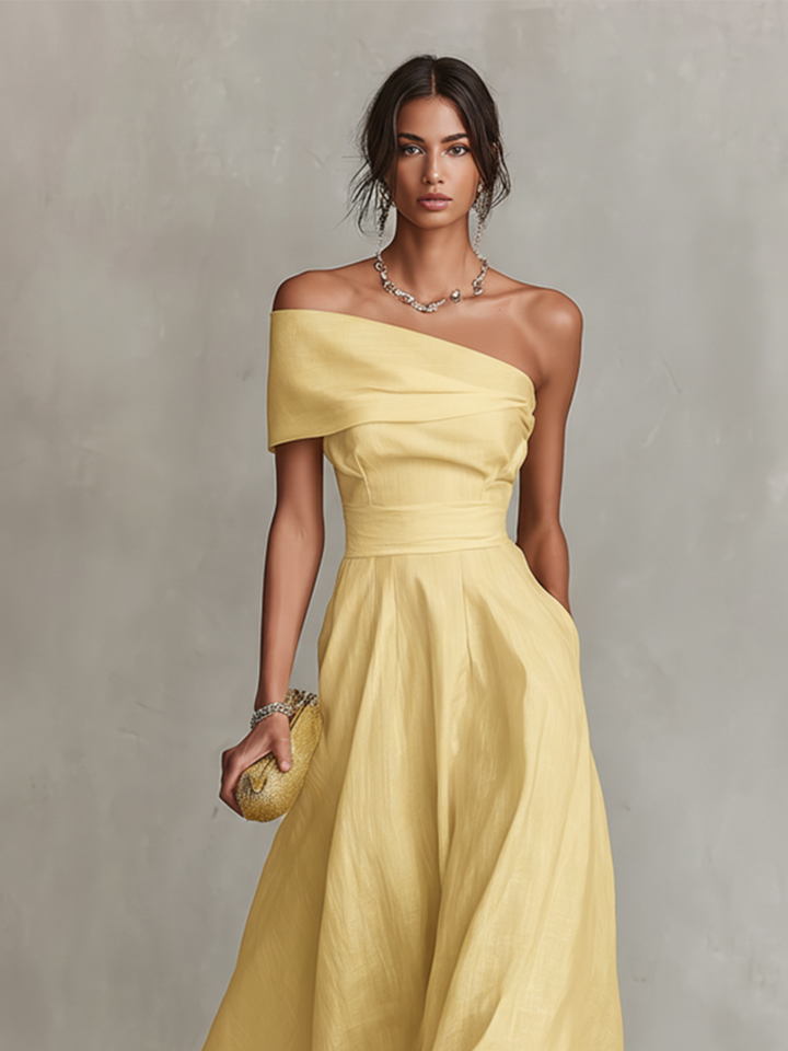 Chic yellow draped one shoulder A-line midi dress. A beautiful wedding guest, cocktail, evening, or party dress.