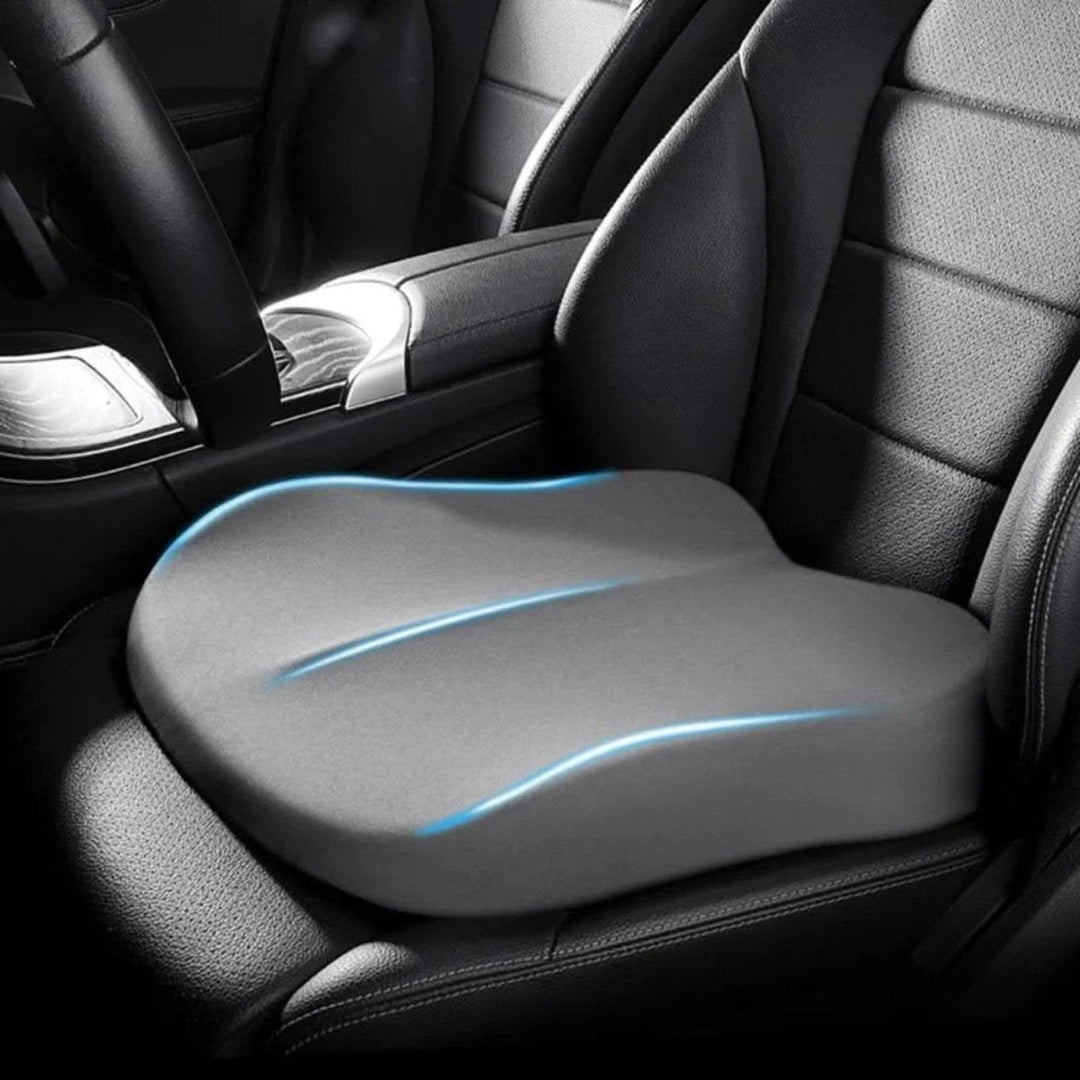 Black ergonomic car seat cushion, a car accessory enhancing driver comfort, posture, and road visibility.