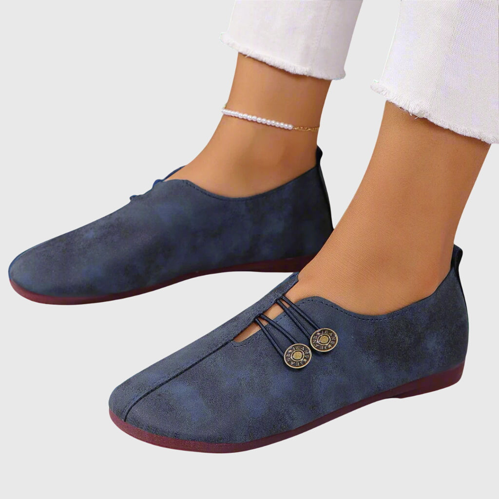 Close-up of decorative button and soft fabric on Evelyn slip-on flats, women footwear ideal for spring and summer
