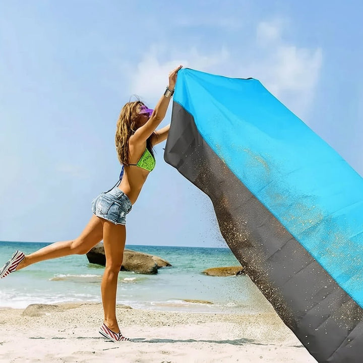 Durable waterproof beach blanket, ideal for family outings, picnics & relaxing outdoors.