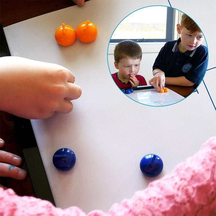 Close-up of vibrant curling stones on the Family Tabletop Curling game mat. Strategy game night.
