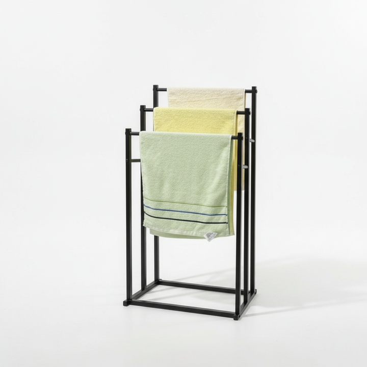 Modern NeatRack freestanding steel towel rack, compact design for small bathrooms, promotes quick drying.