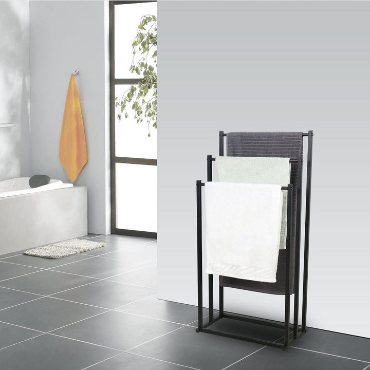 Elegant freestanding steel towel rack, perfect bathroom organizer to keep towels dry and accessible.