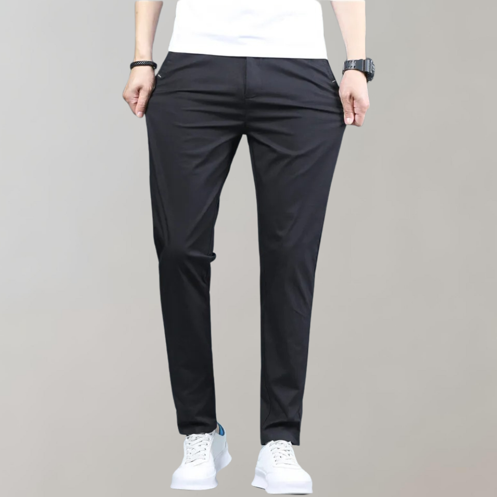 Detail shot of the button and zipper closure on men's comfortable slim-fit casual pants for a secure fit.