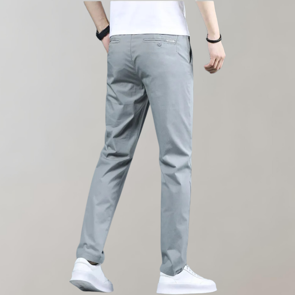Men's versatile slim-fit casual pants folded neatly, showcasing the rich navy blue color for mens fashion.