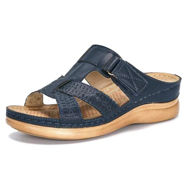 Woman wearing orthopedic sandals, demonstrating flexibility and comfort for active walking.