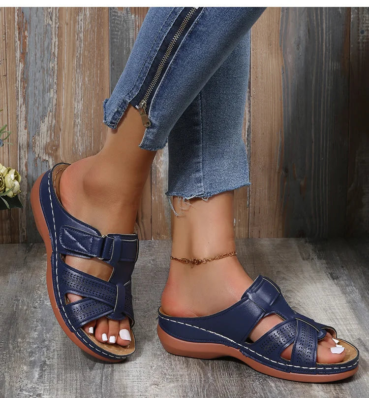 Woman standing in comfort orthopedic sandals, highlighting the supportive arch for posture.
