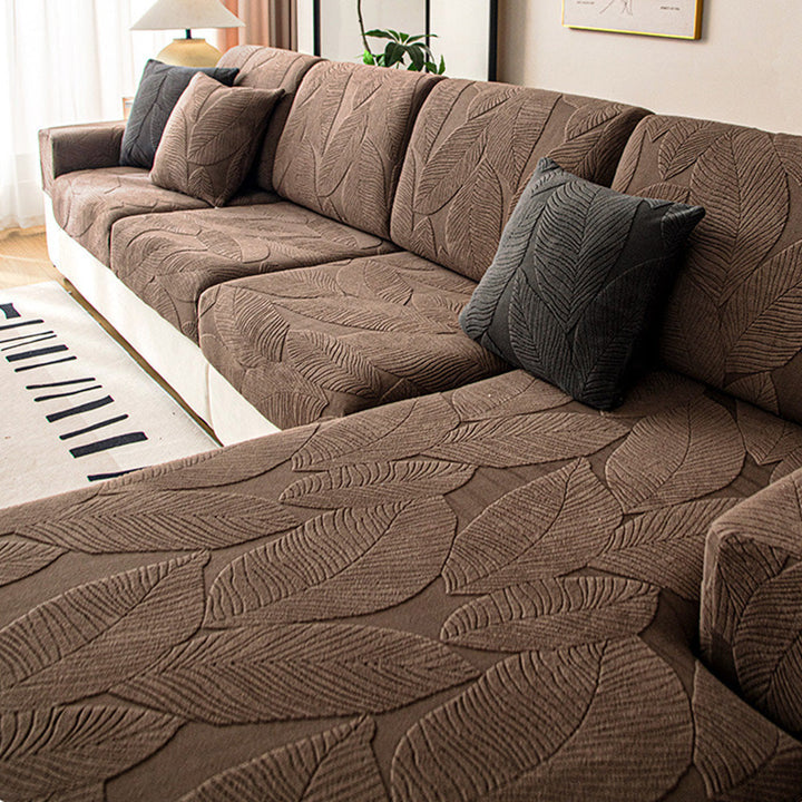 Durable stretch jacquard sofa cover, full wrap design. Leaf pattern furniture protector for pet & spill safety.
