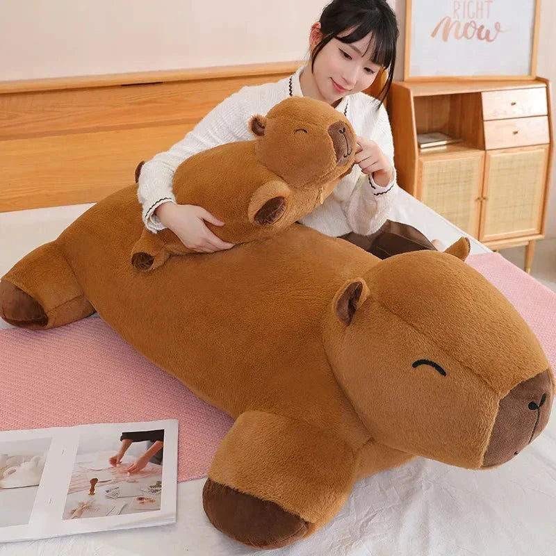 Friendly giant capybara plushie, a soft cuddle buddy & comfort item for kids & adults alike.