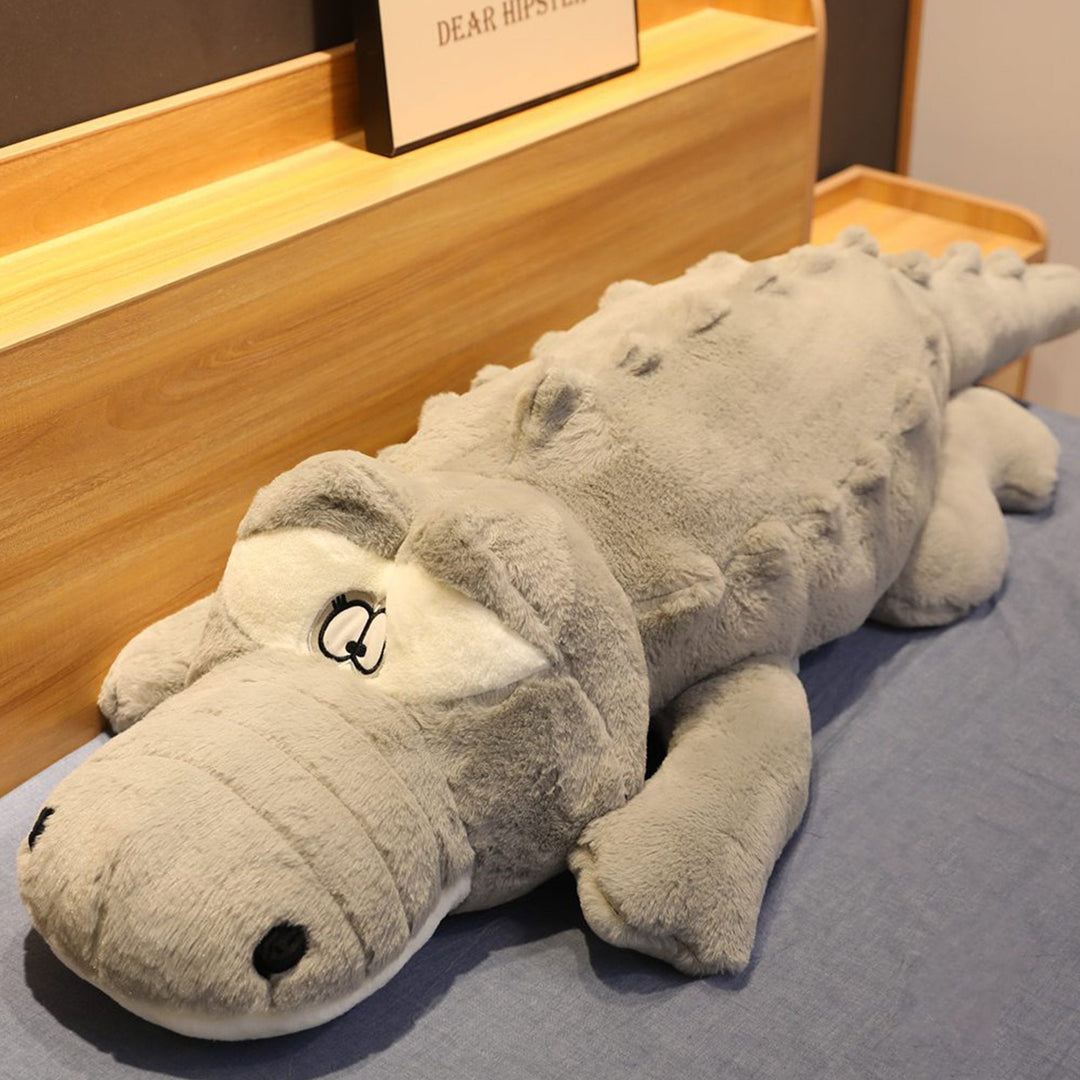 Machine washable giant crocodile plush, a soft & hypoallergenic snuggle buddy. Perfect animal plush gift.