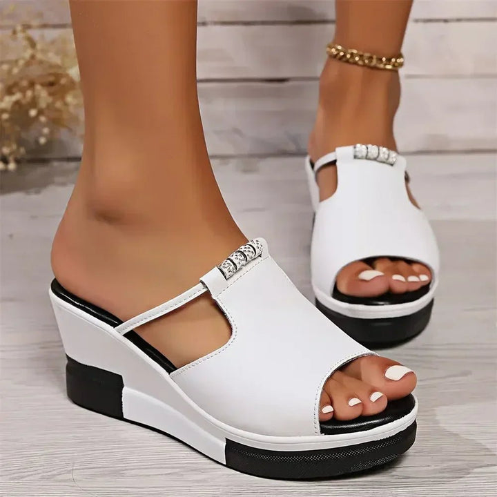 Stylish women's slip-on platform wedge sandals, open-toe design for comfortable summer casual footwear.