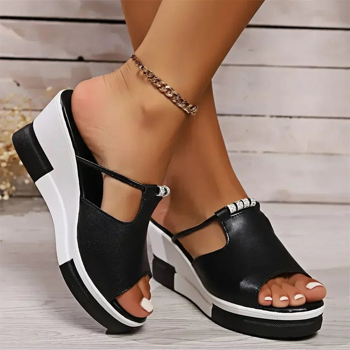 Rhinestone embellished women's open-toe wedge slides, fashionable platform sandals for summer.