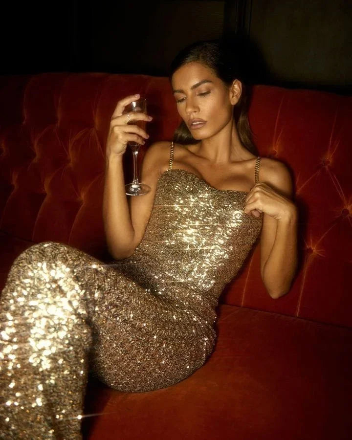 Elegant women's sequin jumpsuit, strapless design, and wide flared legs. Ideal for formal parties & special occasions.