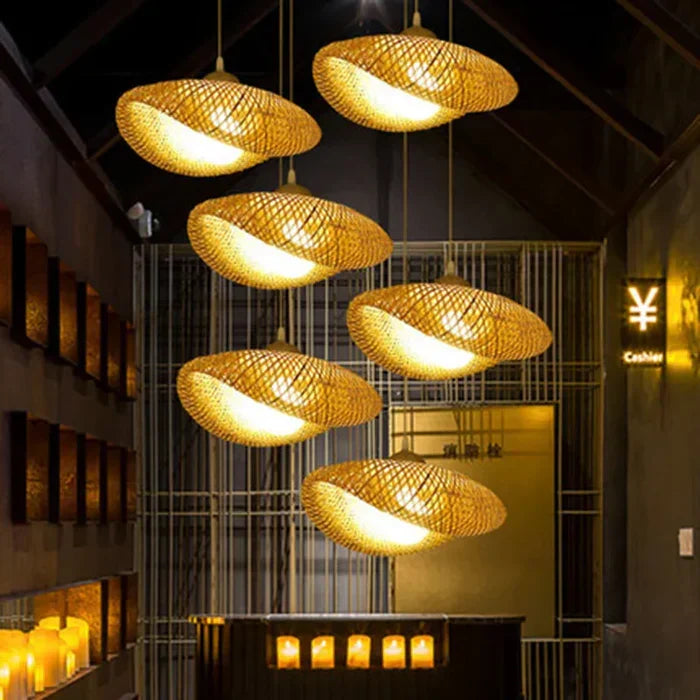 Organic handwoven rattan pendant light, a rustic ceiling fixture offering natural lighting for bohemian homes.