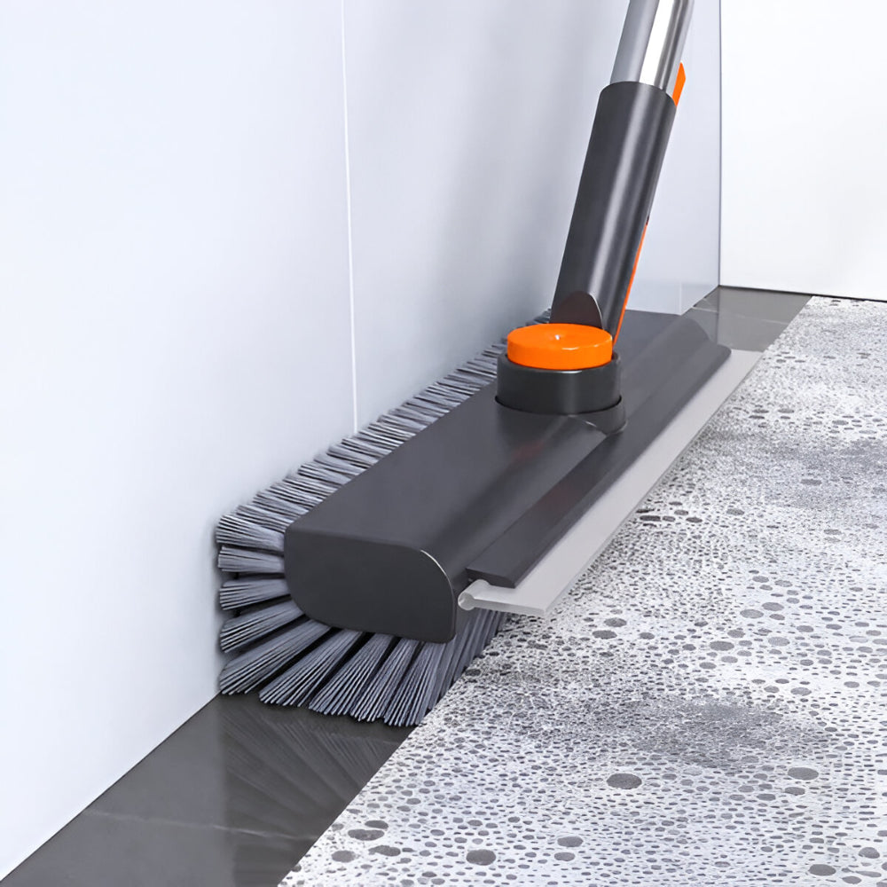 Durable heavy-duty scrub brush with a long handle, perfect for cleaning stubborn dirt on tile, grout, and outdoor floors.
