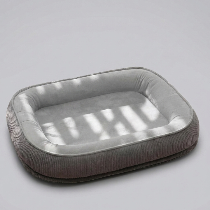 Extra-large dog bed crafted from durable, scratch-resistant suede for maximum pet comfort. Washable and long-lasting.