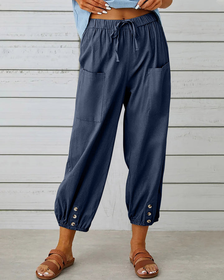 Elegant women's high-waisted wide-leg trousers, perfect for office wear or casual spring outfits. Comfortable & stylish.