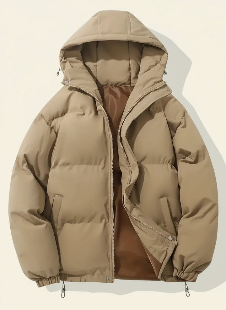 Quilted women's hooded puffer jacket, a warm winter coat. Stylish outerwear for freezing cold weather fashion.
