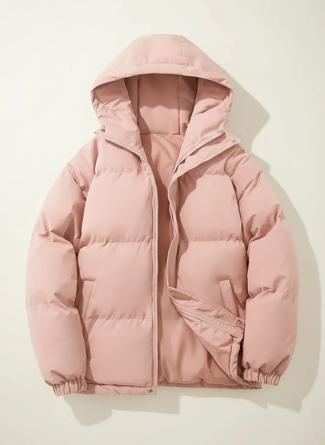 Cozy women's hooded puffer jacket, a warm winter essential. Comfortable outerwear for cold weather protection.