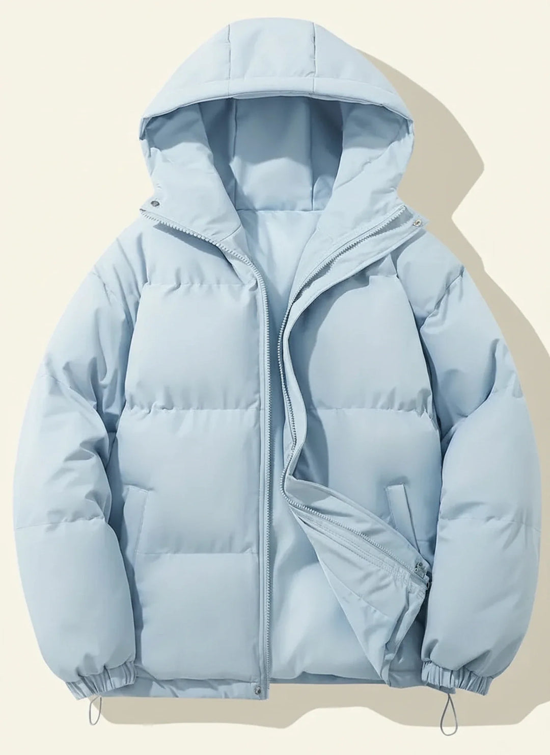 Chic women's hooded puffer jacket, a fashionable winter coat. Quilted outerwear for stylish cold weather.