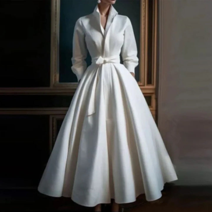 Elegant white women's long sleeve V-neck A-line midi dress. Versatile for daytime or evening sophistication.