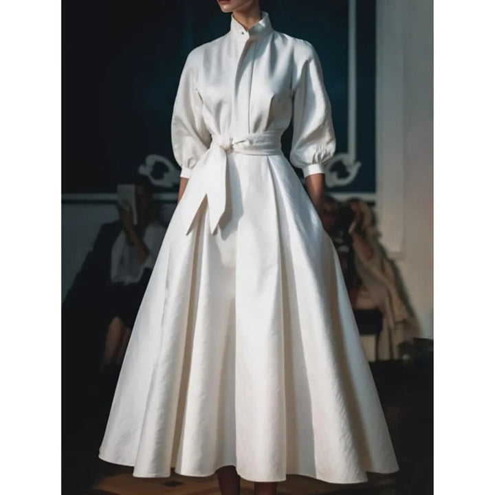 Sophisticated long sleeve V-neck A-line midi dress for women. Elegant, comfortable, and perfect for various occasions.