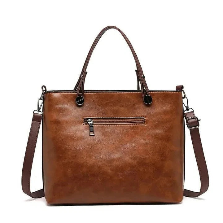 Elegant women's leather handbag, timeless minimalist design, perfect for work or everyday style.