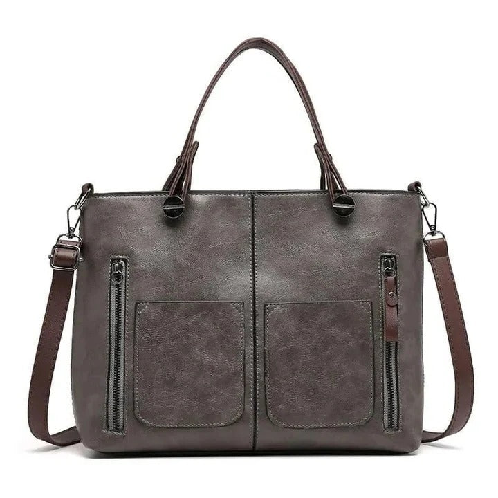 Minimalist women's leather purse, elegant and spacious, suitable as a work bag or chic everyday accessory.