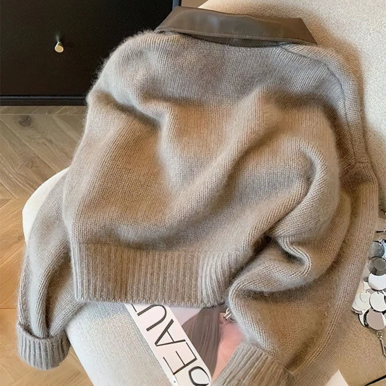 Close-up of cable knit texture on a khaki women's cardigan with a zip front