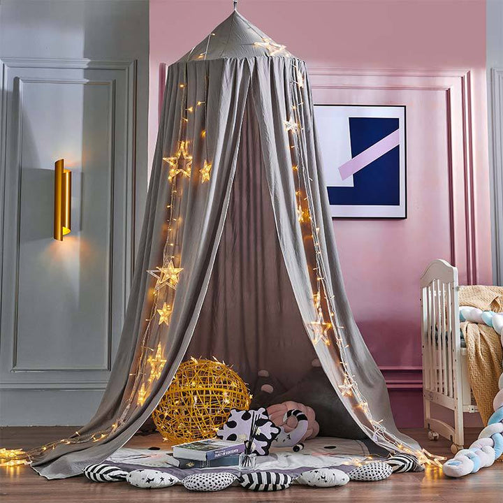 Stylish room decor: a hanging bed canopy that adds a whimsical touch to a child's room.