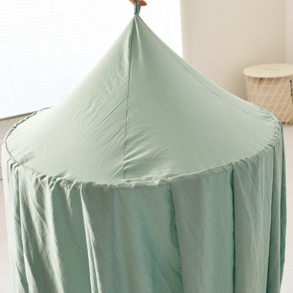 Children's room decor: a vibrant kids canopy that transforms a bed into a cozy reading nook.