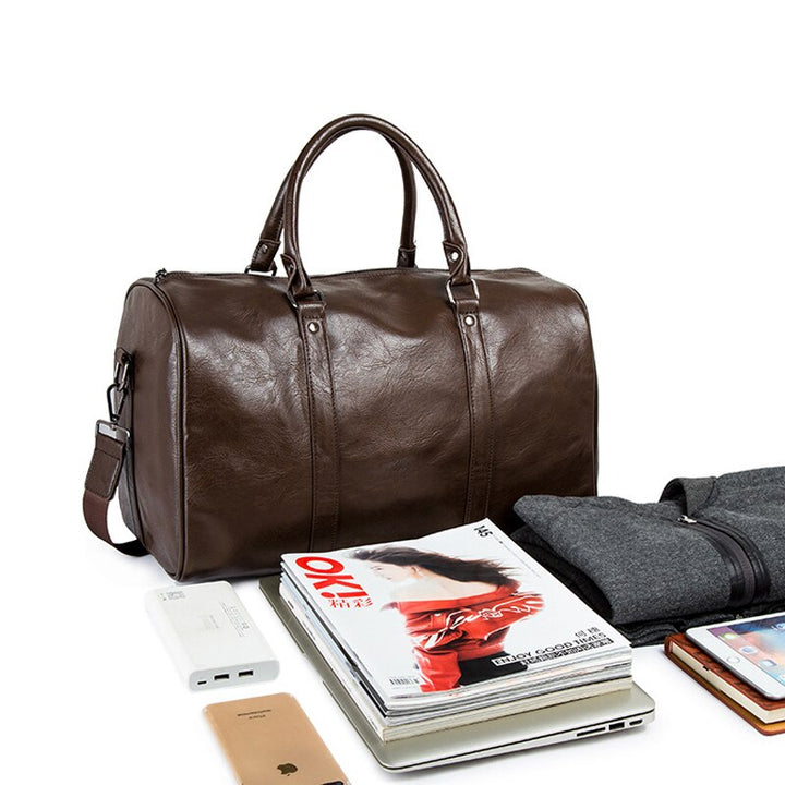 Durable brown faux leather duffel bag, large and lightweight, excellent for unisex gym or travel.