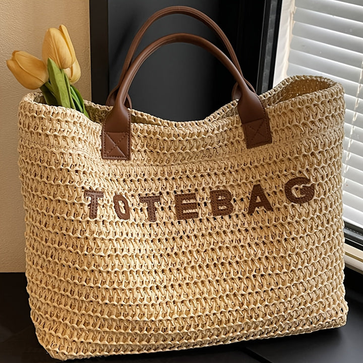Natural-look large woven tote for women, accented with rich leather handles.