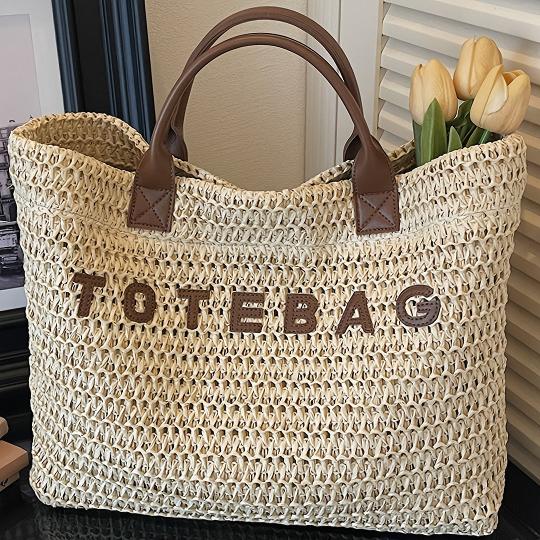 Fashionable women's large woven tote with comfortable leather shoulder straps.