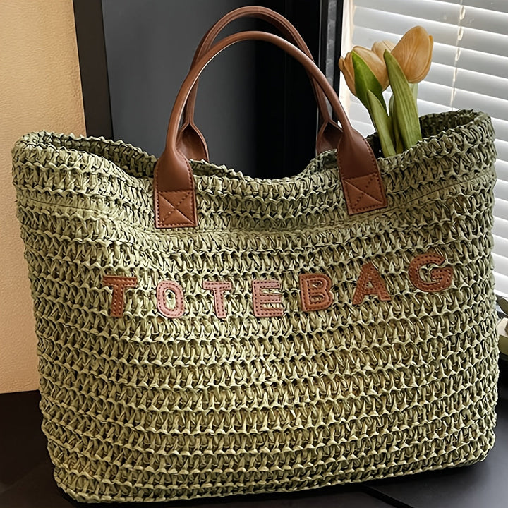 Women's stylish travel tote, a large woven bag complete with sturdy leather handles.