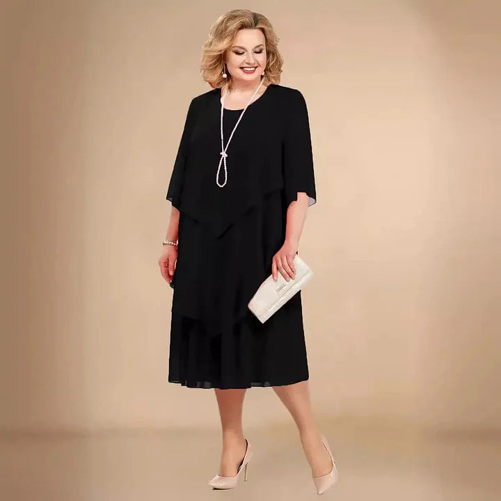 Stylish women's black A-Line midi dress with 3/4 sleeves & a round neck. An elegant choice for parties & fashion.
