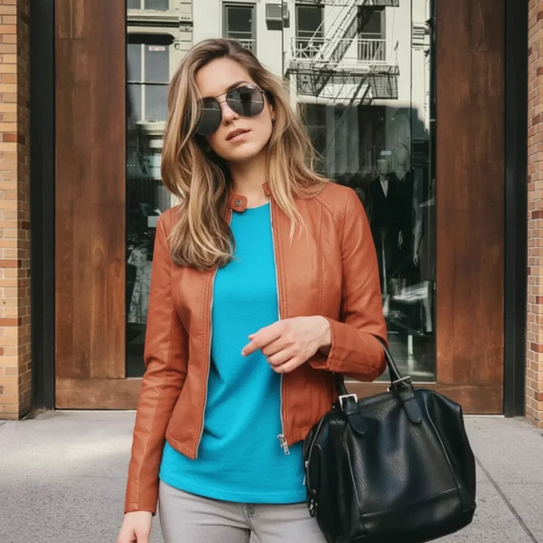 Women's chic zip-up jacket. Collarless, fitted design for a modern, sophisticated, and versatile layering piece.