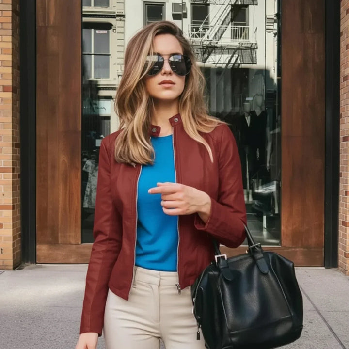 Fitted women's zip-up jacket with a collarless design. Versatile fashion for everyday elegant style.