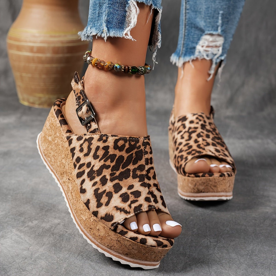 Leopard print platform wedge sandals for women, featuring a comfortable design and buckle strap closure.