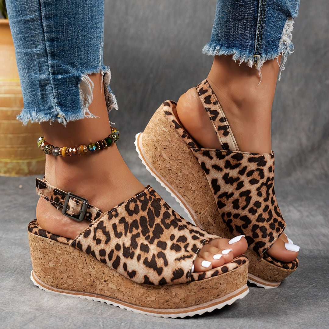 Stylish women's leopard print wedge sandals, perfect for summer casual wear or festival fashion.