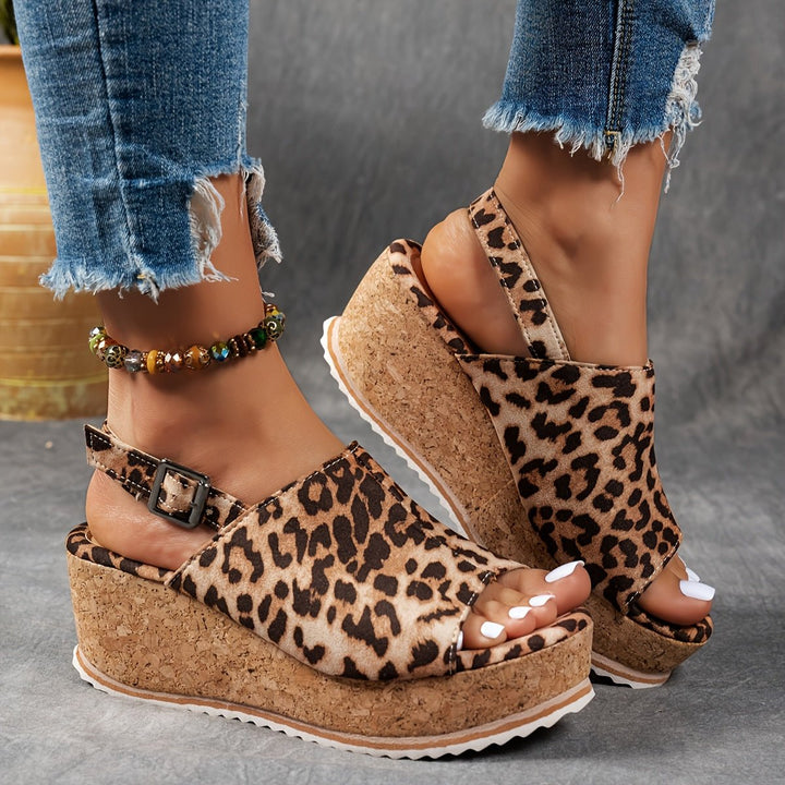 Stylish women's leopard print wedge sandals, perfect for summer casual wear or festival fashion.